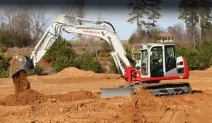 Takeuchi excavator working digging dirt
