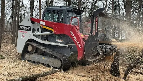 Takeuchi TL12 compact track loader with a mulching head from the ACT rental fleet